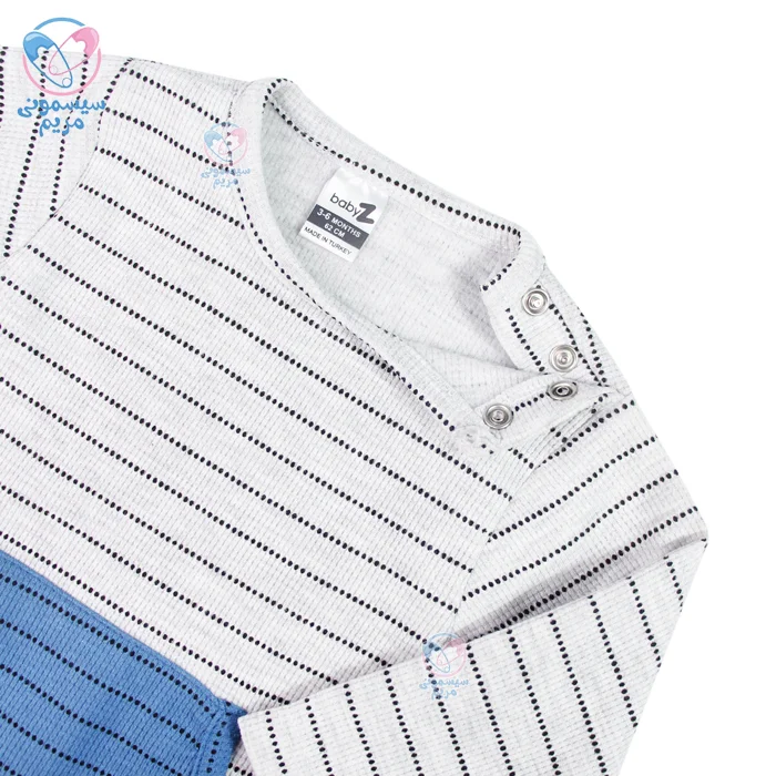 این لباس دارای یک جفت دکمه در سرشانه است که پوشیدن و درآوردن آن را بسیار راحت می‌کند.